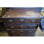 A mahogany bachelor type chest, having a hinged lid, four long drawers and with two sliders, in need