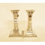 A pair of late Victorian silver Corinthian column candlesticks, drilled for electricity, Sheffield