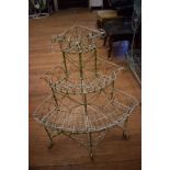 A painted wirework corner planter, 65 cm wide