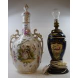 A Limoges two handled vase and cover, decorated a courting scene and flowers, 43 cm high, and