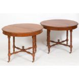 A pair of Arts and Crafts walnut occasional tables, on turned legs and stretchers, 100 cm