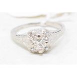 An Art Deco 18ct white gold, platinum and diamond ring, with a cluster of five brilliant cut stones,
