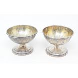 An early 19th century silver pedestal dish, with a gilt interior, London 1815, and another matching,