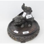 A Chinese bronze incense burner, in the form of a Dog of Fo, 16 cm high, and a Chinese carved