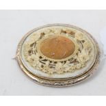 A late 19th/early 20th century gold and carved ivory oval brooch Report by RB The combined total