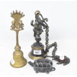 An Indian bell and chain, surmounted by Ganesh, 9 cm diameter, another, a metal tortoise and a metal