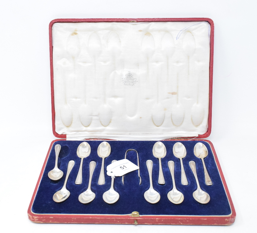 A set of twelve silver teaspoons, with bright cut decoration, with matching sugar tongs, London