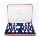 A set of twelve silver teaspoons, with bright cut decoration, with matching sugar tongs, London