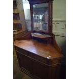 A Howard & Sons pine corner dressing table, the right panel door having an inset enamel makers