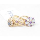 A 9ct gold, opal and amethyst ring, approx. ring size W, and two other 9ct gold rings (3) Report