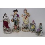 A pair of Continental porcelain figures, of gardeners, damages, 23 cm high, another pair, and a