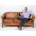 A leather upholstered three seater settee, on square tapering legs See illustration Report by RB