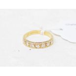 An 18ct gold and seven stone diamond half hoop ring, approx. ring size L