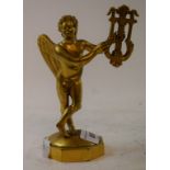 A gilt brass figure, of a cherub playing a lyre, 16 cm high