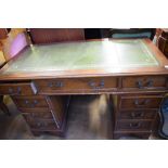 A reproduction pedestal desk, 122 cm wide, a floor standing corner cupboard, a dining table and