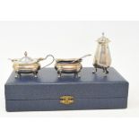 A silver three piece condiment set, Birmingham 1992, cased, and assorted silver plated items