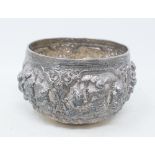 A Burmese silver coloured metal bowl, decorated figures, 12 cm diameter