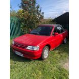 A 1991 Ford Escort Mk IV 1.6i cabriolet, registration number H570 HPJ, red. This Escort is