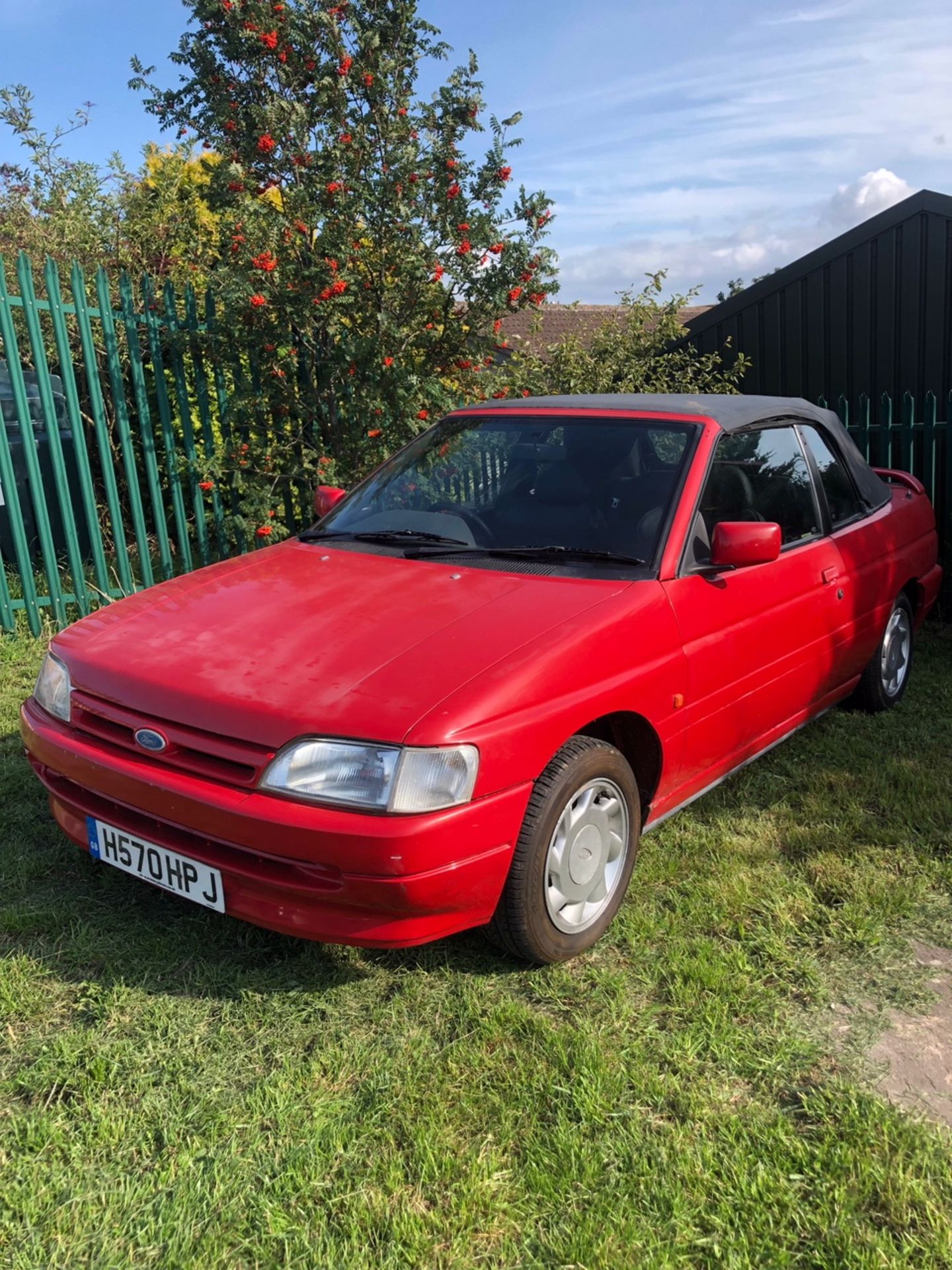 A 1991 Ford Escort Mk IV 1.6i cabriolet, registration number H570 HPJ, red. This Escort is