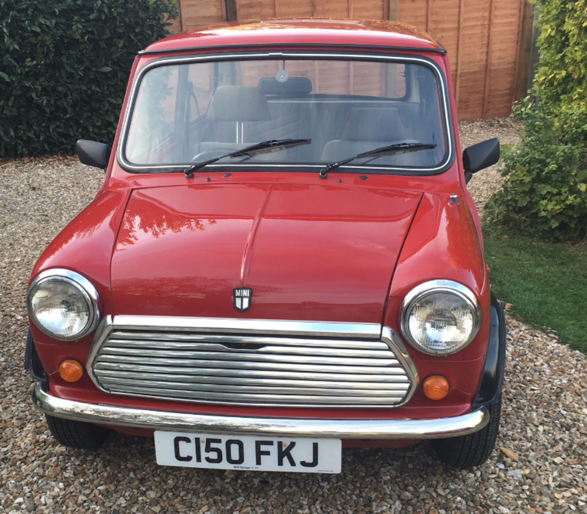 A 1986 Austin Mini 1000 Chelsea, registration number C150 FKJ, red. Introduced in 1985, the Mini