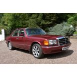 A 1990 Mercedes-Benz 420 SE saloon, registration number G646 HKG, Almandine metallic red. This 420SE