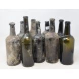 A 19th century glass wine bottle, 27 cm high, and eight others similar (9) Report by GH One of the