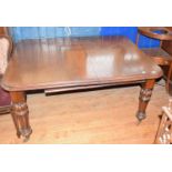A Victorian mahogany extending dining table, on turned and fluted legs, with two extra leaves, 207