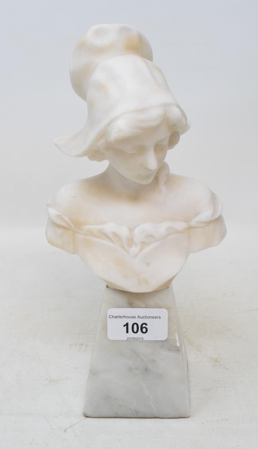 An early 20th century carved alabaster bust head, of a Breton girl, on a tapering stand, 24 cm high