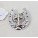 A silver brooch, in the form of a fox within a horseshoe Report by RB Modern