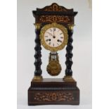 A late 19th century French portico clock, the 8.5 cm enamel dial with Roman numerals, fitted an