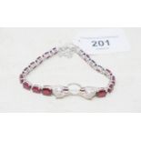 A silver and ruby set panther bracelet Report by RB Modern