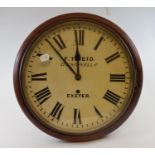 A wall clock, the 33 cm diameter painted dial signed FT Reid, 177 Sidwell St, Exeter, fitted a brass