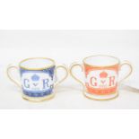 A Royal Crown Derby George V miniature commemorative two handle mug, 4 cm high, and another (2)