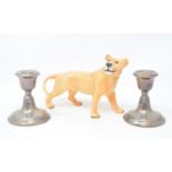 A Beswick lioness, gloss, a pair of filled silver dwarf candlesticks, ceramics, glass and other