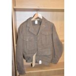 A 1949 pattern British Army battle dress blouse, size 8, dated 1952 and the matching trousers,