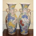 A large pair of Japanese Satsuma baluster vases, moulded in the form of baskets, decorated flowers