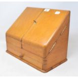 An Edwardian oak stationery box, 38 cm wide