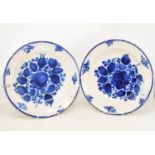 A pair of tin glazed blue and white bowls, decorated flowers, 31.5 cm diameter, two pottery meat