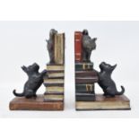 A pair of painted bronze cat and dog bookends, 14 cm high (2) Modern