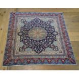 An Anatolian rug, decorated a central medallion and floral motifs on a dark blue ground, within a