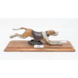 A novelty painted metal running hound paperclip, 27.5 cm wide Modern