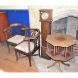 A mahogany revolving octagonal book table, 55 cm diameter, a dwarf longcase clock and two corner