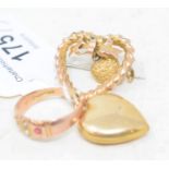 A 9ct gold heart shaped brooch, a similar locket, and a 9ct gold, seed pearl and ruby ring (3)