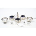 A Victorian pair of silver pedestal salts, Birmingham 1863, assorted silver pepperettes, and other