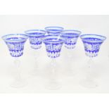 A set of six hock glasses, with etched decoration, one chipped, 21.5 cm high, a Waterford cut