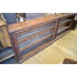 Two late Victorian/Edwardian oak bookcases, formally fitted into recesses, 129 and 137 cm wide (2)