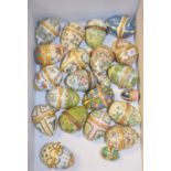 A collection of 21 Halcyon Days enamel boxes, mostly Easter Years