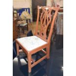 An 18th century style child's chair, with a drop in seat
