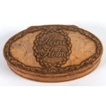 An oval treen snuff box, carved swag and foliate decoration, the lid Anne Holm within a wreath, 9.