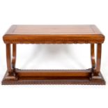 An Art Deco style rosewood console table, on U shaped supports and a plinth base, 122 cm wide See